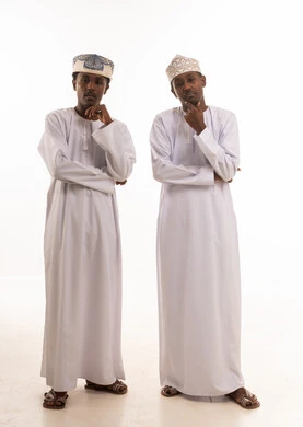 Two Omani Men in Traditional Dishdasha Thinking Pose