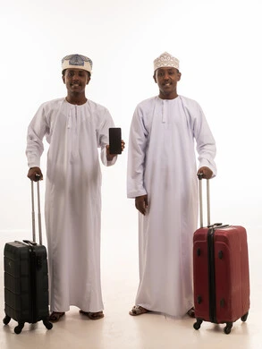 Omani Men with Travel Suitcases and Smartphone