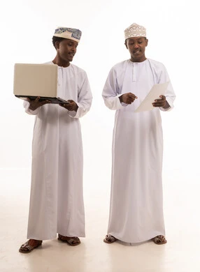 Omani Men Using Laptop on White Background