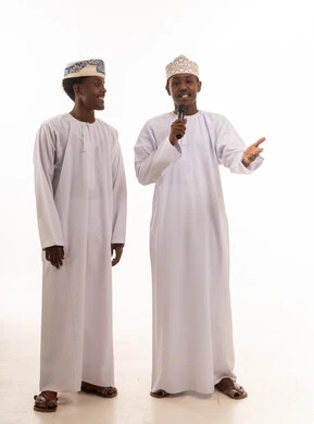 Omani Men in Traditional Dress Speaking into Microphone