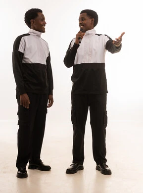 Omani Men in Sportswear Speaking into Microphone