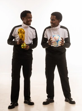 Omani Men Holding Trophy and Soccer Ball in Studio