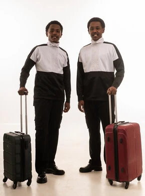 Omani Men Standing with Travel Suitcases in Studio