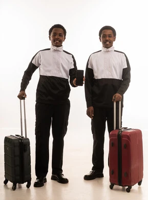 Omani Men with Travel Suitcases and Smartphone
