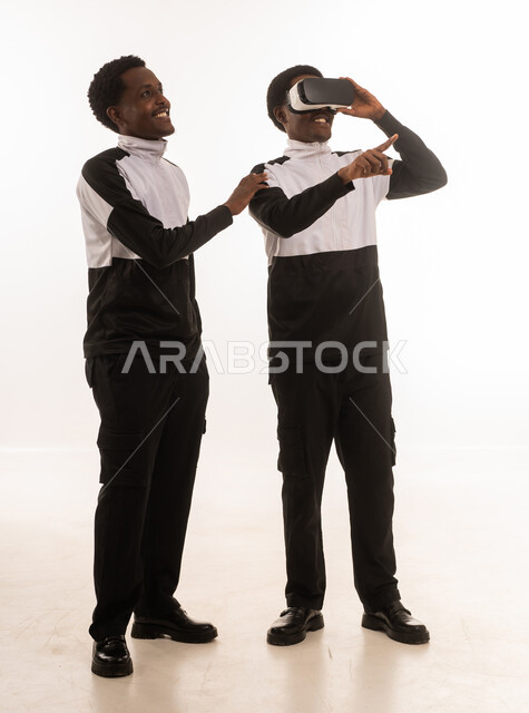 Omani Men Using VR Headset in Studio Shot