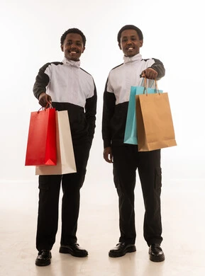 Two Omani Men Holding Shopping Bags on White Background