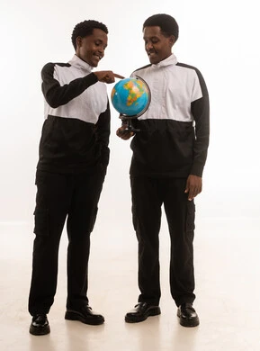 Two Omani Men Holding World Globe on White Background