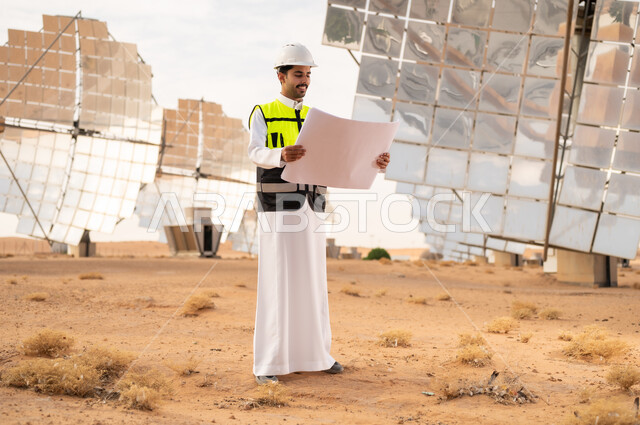 Saudi Engineer with Blueprint at Solar Power Plant