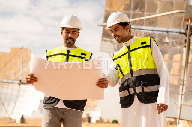 Arab Engineers with Blueprints at Solar Power Station