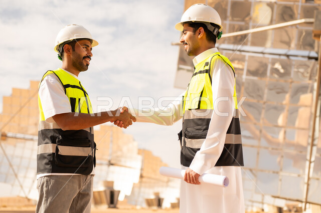 Arab Engineers Shaking Hands at Solar Power Plant