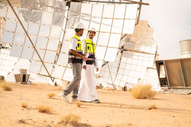 Arab Engineers at Solar Energy Farm in Desert