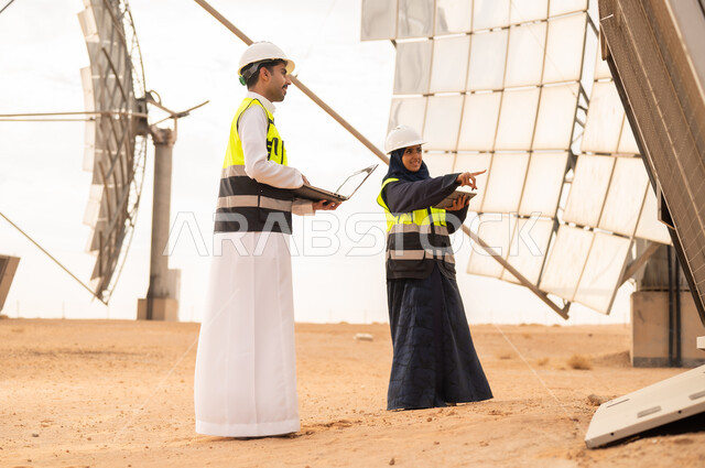 Saudi Engineers Inspecting Solar Energy Field