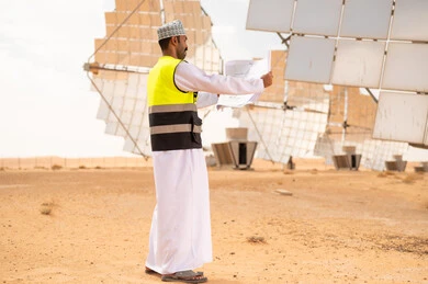 Omani Engineer at Solar Power Station in Desert