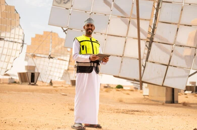 Omani Engineer in Solar Energy Field with Tablet