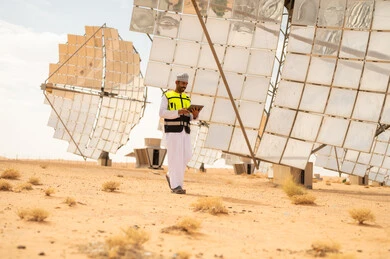 Omani Engineer with Tablet at Desert Solar Power Plant