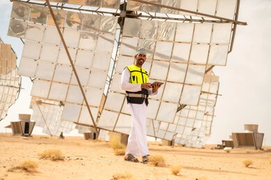 Omani Engineer at Solar Power Plant in Desert