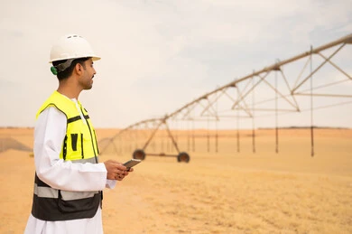Saudi Engineer at Desert Farm with Irrigation System