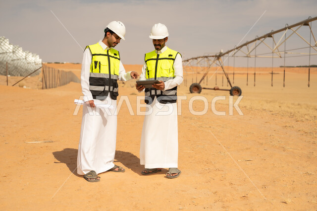 Saudi Engineers Inspecting Desert Irrigation System