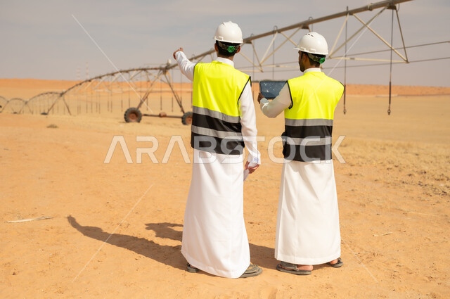 Saudi Engineers Inspecting Desert Irrigation System