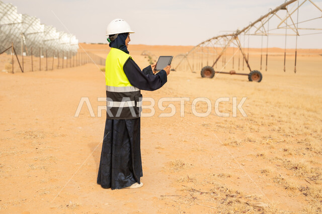 Arab Female Engineer with Tablet in Desert Farm