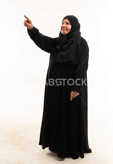 Elderly Arab Woman Pointing on White Background