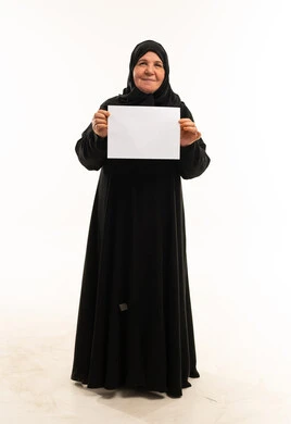 Senior Saudi Woman Holding Blank Sign on White Background