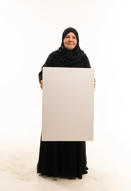 Elderly Saudi Woman Holding Blank White Banner