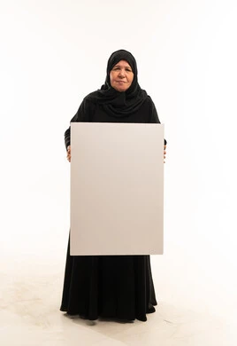 Elderly Saudi Woman Holding Blank White Sign Board