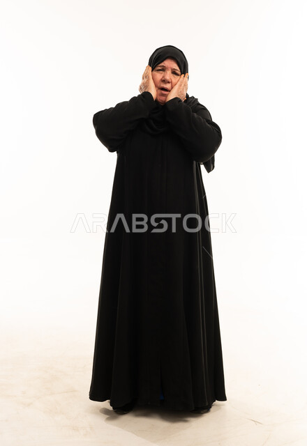 Elderly Saudi Woman in Abaya with Surprised Expression