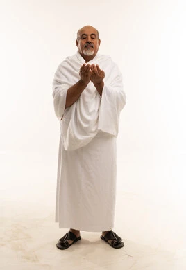 Saudi Pilgrim in Ihram Performing Supplication
