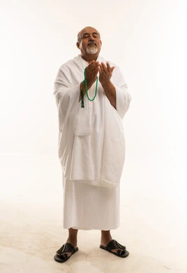 Elderly Saudi Man in Ihram Praying with Beads