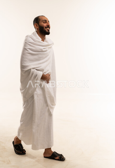 Saudi Man in Ihram Clothing Walking in Studio