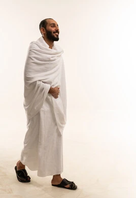 Saudi Man in Ihram Clothing Walking in Studio