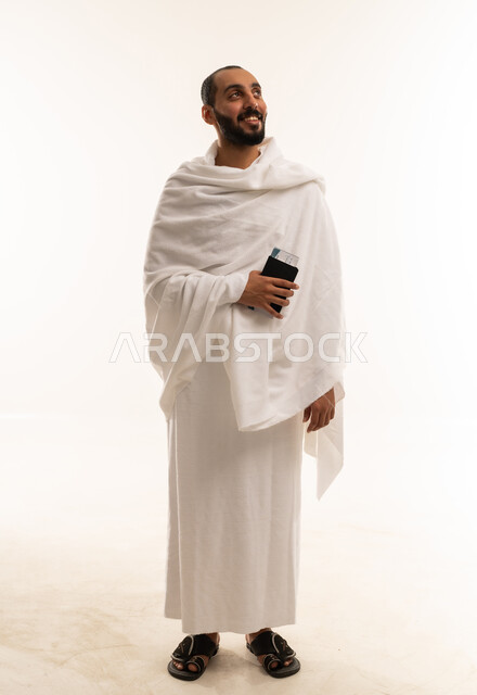 Saudi Man in Ihram Holding Passport for Hajj