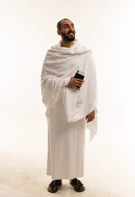 Saudi Man in Ihram Holding Passport for Hajj