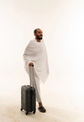 Saudi Man in Ihram with Suitcase for Hajj
