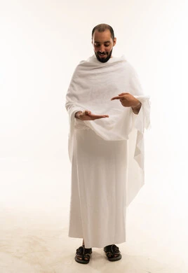 Saudi Man in White Ihram Pointing at Open Palm