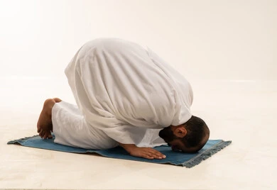 Saudi Man Performing Sujud Prayer in White Thobe