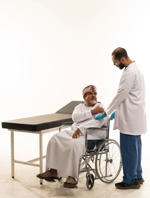 Omani Patient in Wheelchair with Medical Doctor