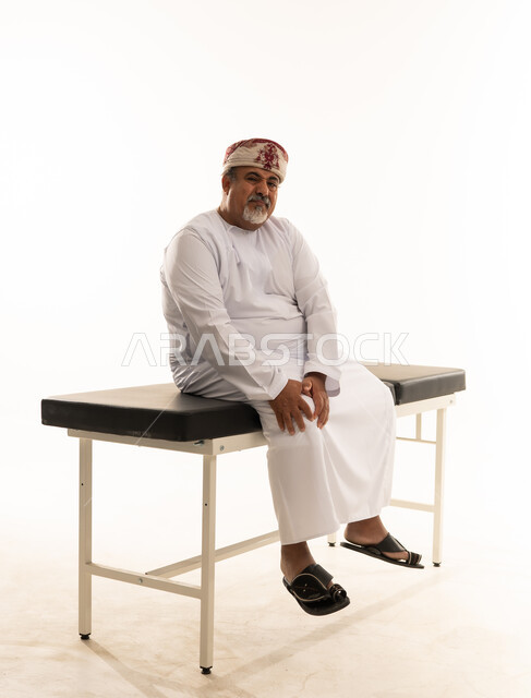 Omani Man on Medical Examination Table Studio Portrait