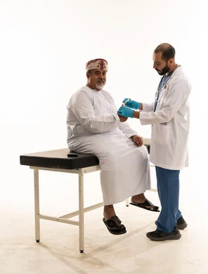 Omani Patient Receiving Medical Injection from Doctor
