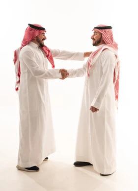 Saudi Men Shaking Hands in Traditional Attire