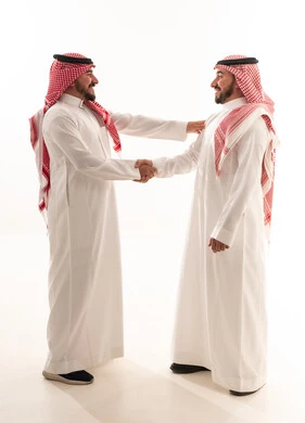 Saudi Men Shaking Hands in Traditional Dress