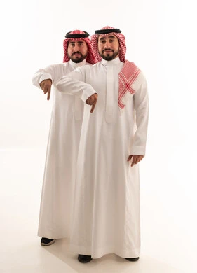 Two Saudi Men Pointing Down in Traditional Dress