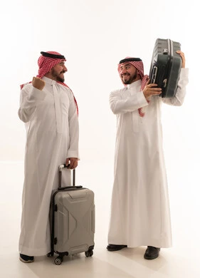 Two Saudi Men with Travel Luggage on White Background
