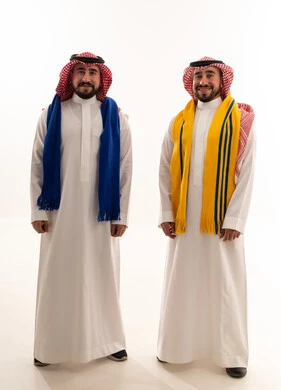 Saudi Men in Traditional Dress with Sports Scarves