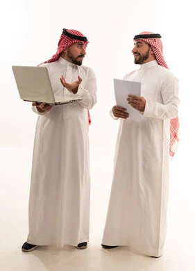 Saudi Businessmen with Laptop and Documents