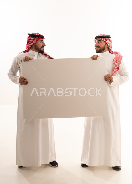 Two Saudi Men Holding Blank White Board in Studio
