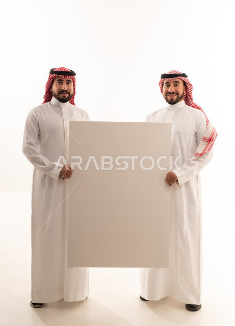 Two Saudi Men Holding Blank White Sign Board