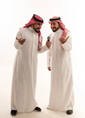 Saudi Men in Traditional Thobes Conducting Interview